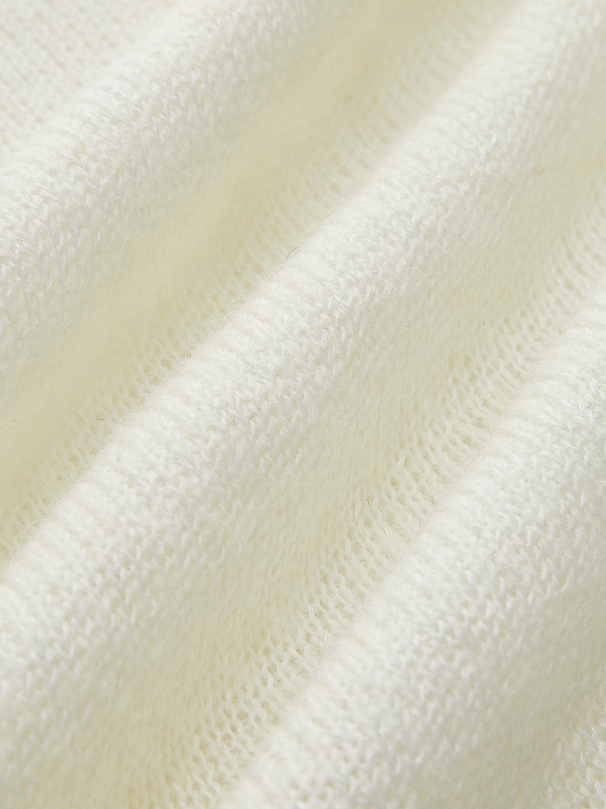 Andreina | Struktureret gennemsigtig striksweater