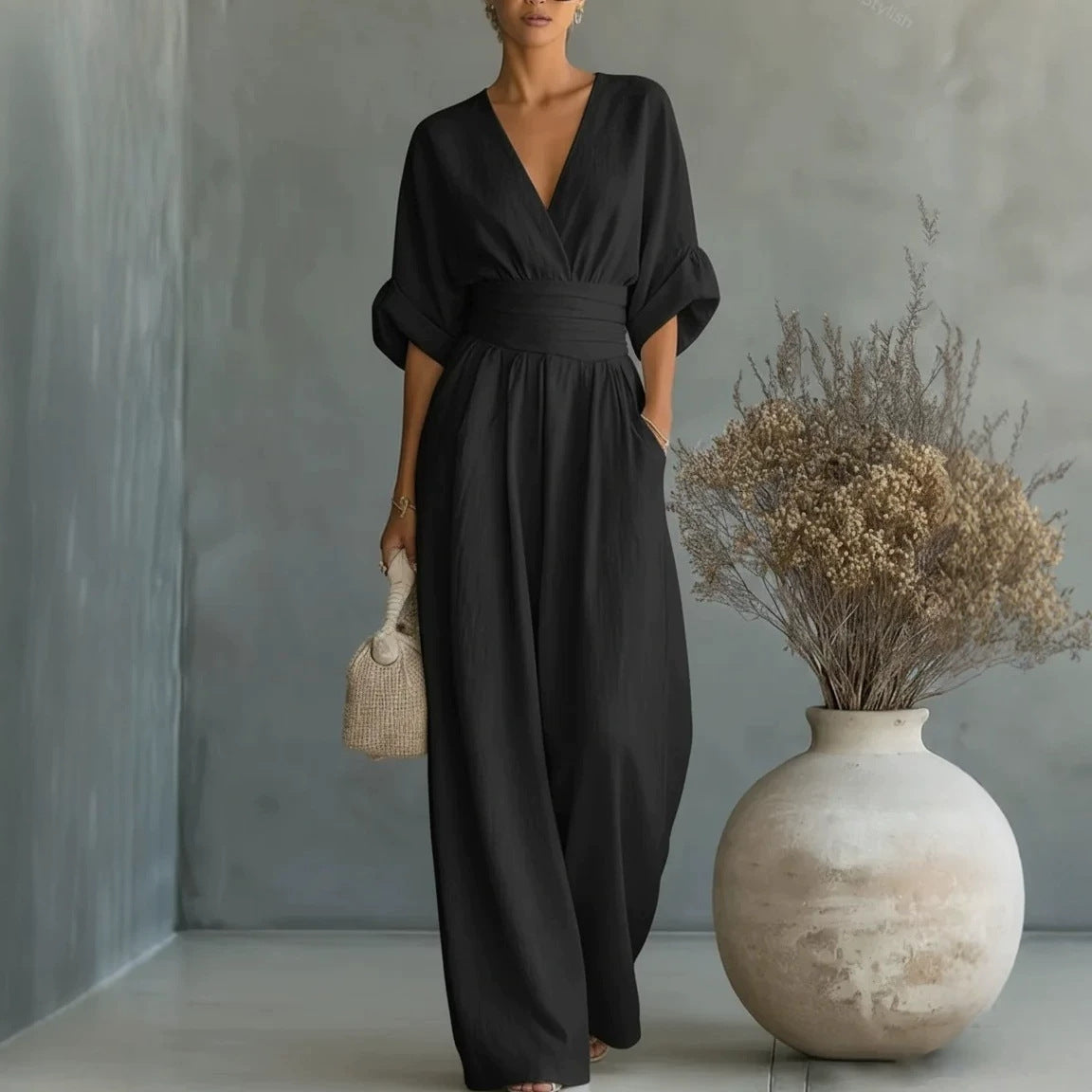 Elowen – Elegant draperet jumpsuit med vide ben
