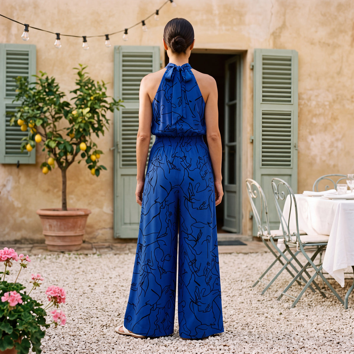 Ginevra – Jumpsuit med halterneck og palazzobukser