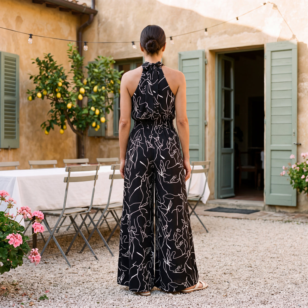 Ginevra – Jumpsuit med halterneck og palazzobukser