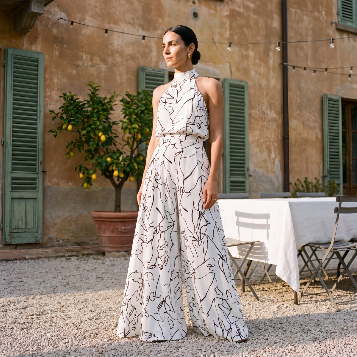 Ginevra – Jumpsuit med halterneck og palazzobukser