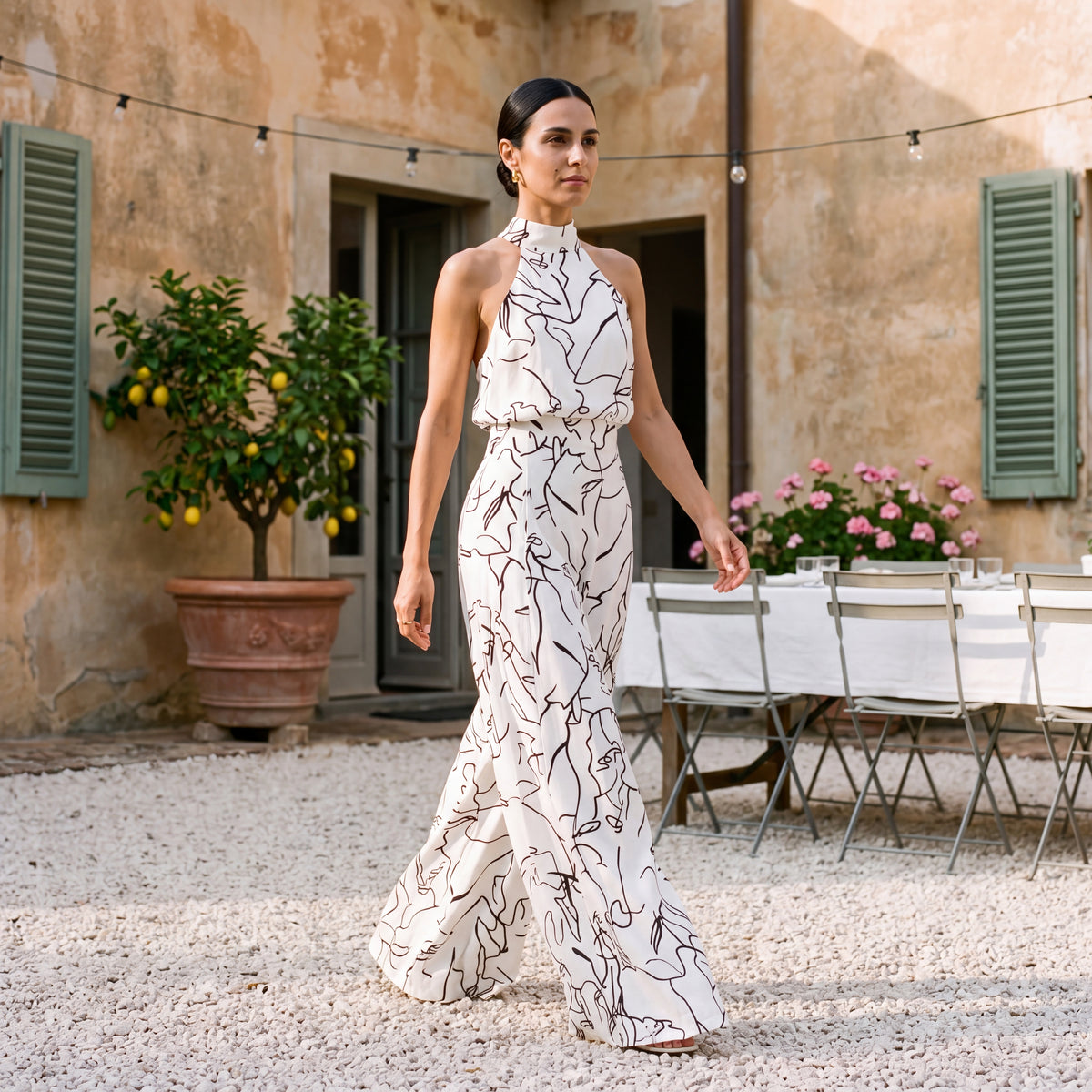 Ginevra – Jumpsuit med halterneck og palazzobukser