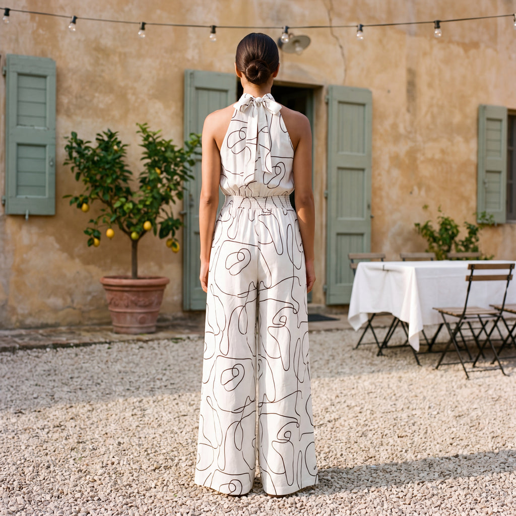 Ginevra – Jumpsuit med halterneck og palazzobukser